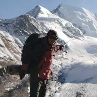 trekker-showing-mountain 